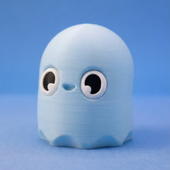 Powder-blue ghost bean fidget figurine with wide round eyes, arms raised