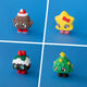 Poopie, Stella, Plum and Tannen Christmas character clickers shown together as a four-piece bundle