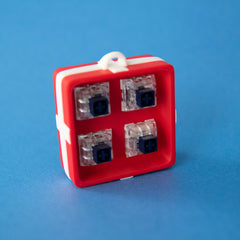 Red four-slot gift box base with four clicky switches fitted