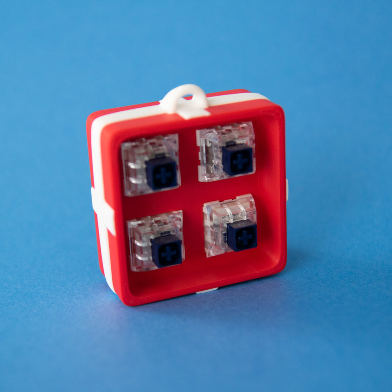 Red four-slot gift box base with four clicky switches fitted