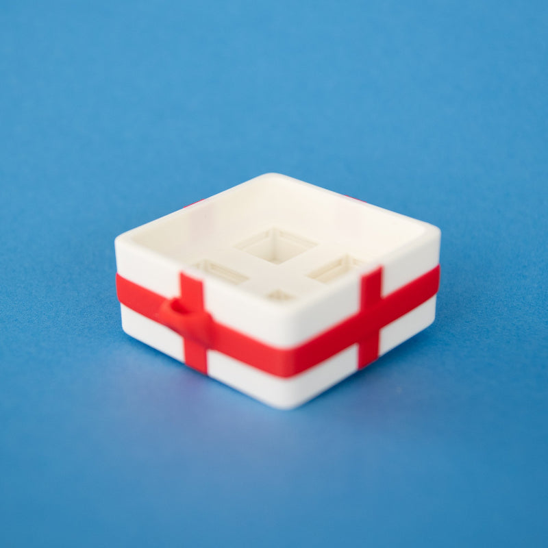 Empty white four-slot gift box clicker base from above