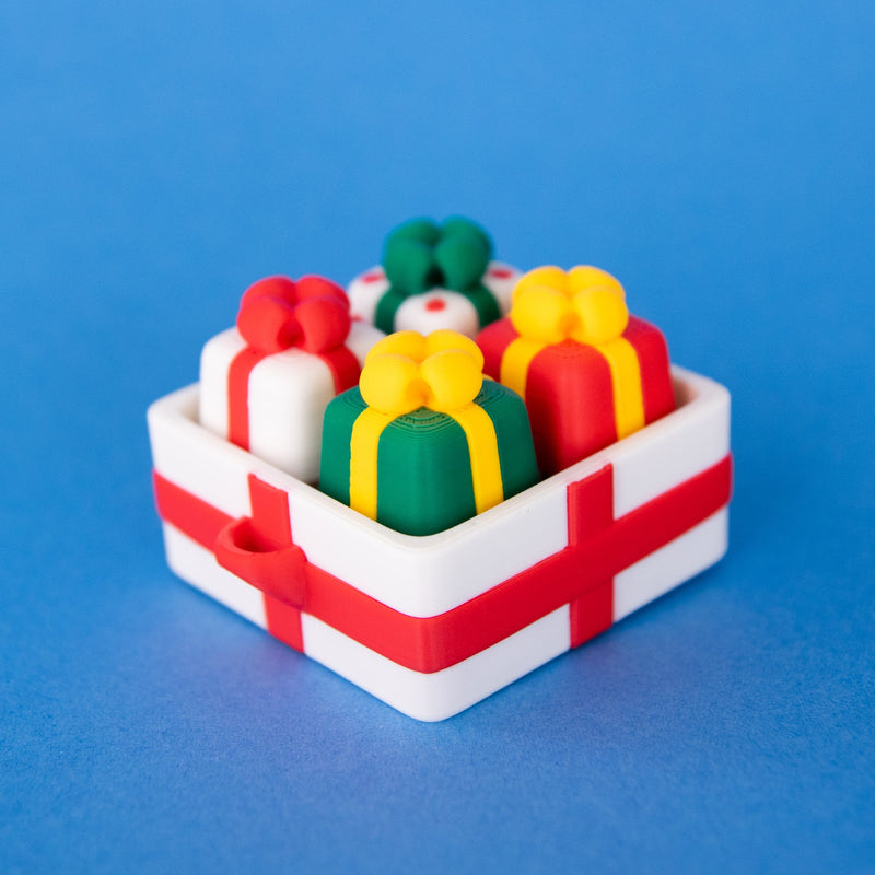 White four-slot gift box base with present keycaps, front view