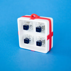 White four-slot gift box base with switches, front view