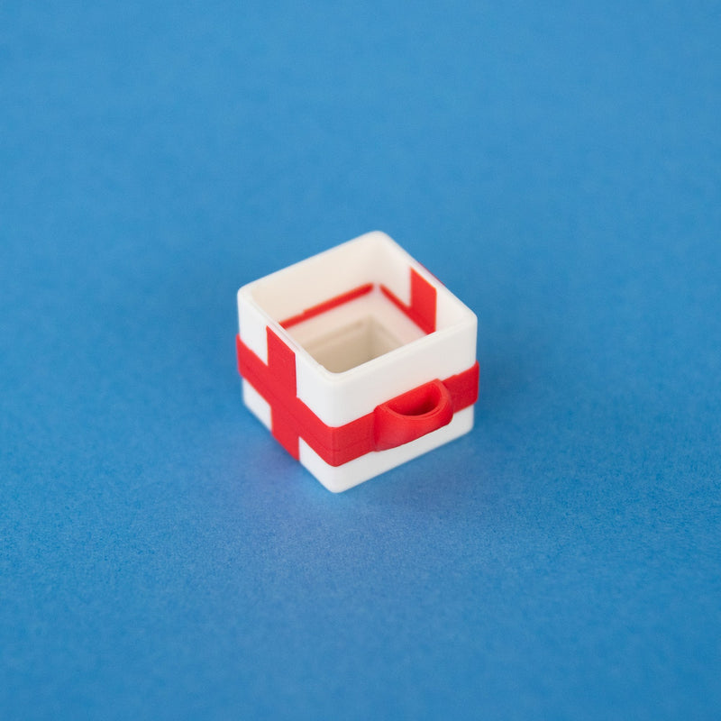Empty white single gift box clicker base, angled view