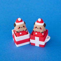 Two single gift box clicker bases holding Santa puppy keycaps