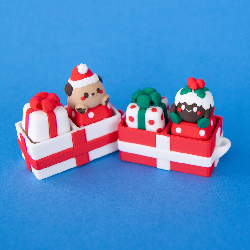 White and red two-slot gift box clicker bases filled with Christmas keycaps