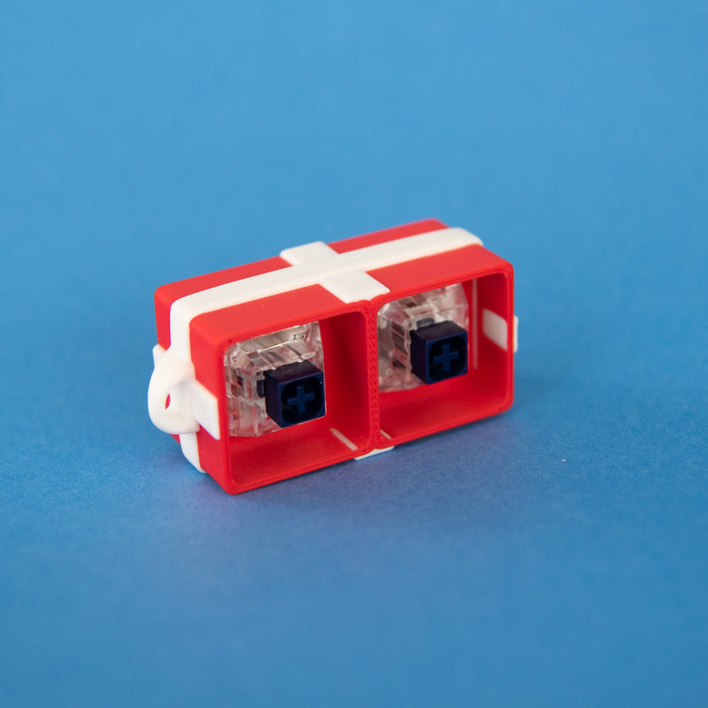 Red two-slot gift box base with switches, angled view