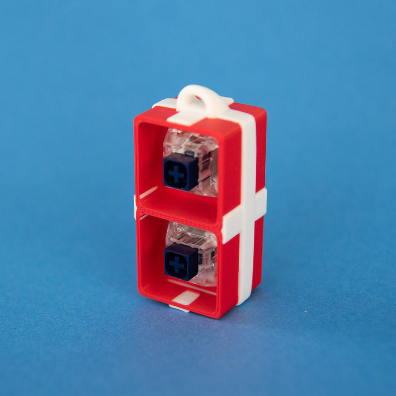 Red two-slot gift box base with switches, front view