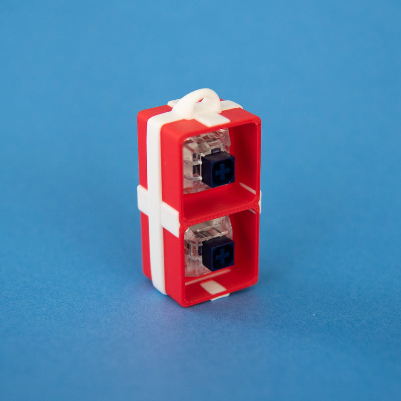 Red two-slot gift box base with switches, standing upright