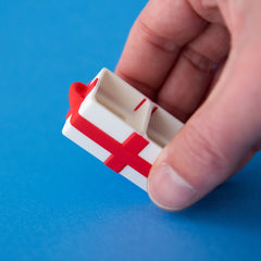 Empty white two-slot gift box base held in a hand