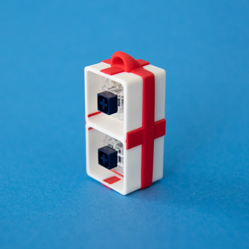 White two-slot gift box base with switches, standing upright