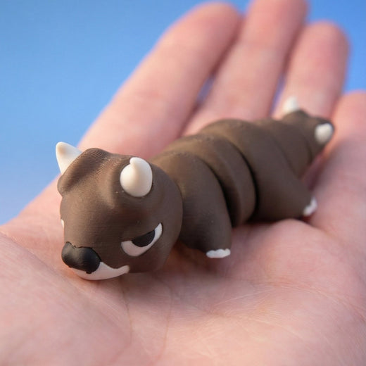 Brown bull dragon fidget toy seen from a different angle, showing its horns and segmented body