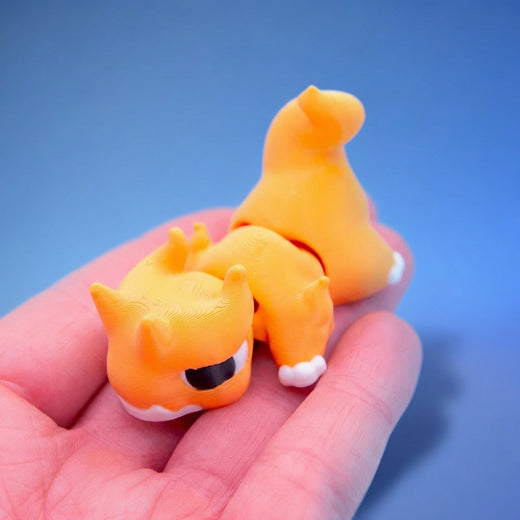 Close-up of the orange chonk dragon fidget toy's face