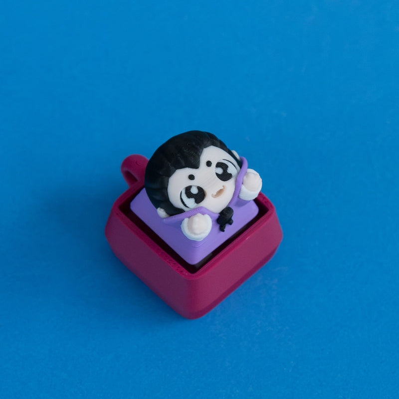 Fangy the vampire after dinner keycap on plum clicker base.