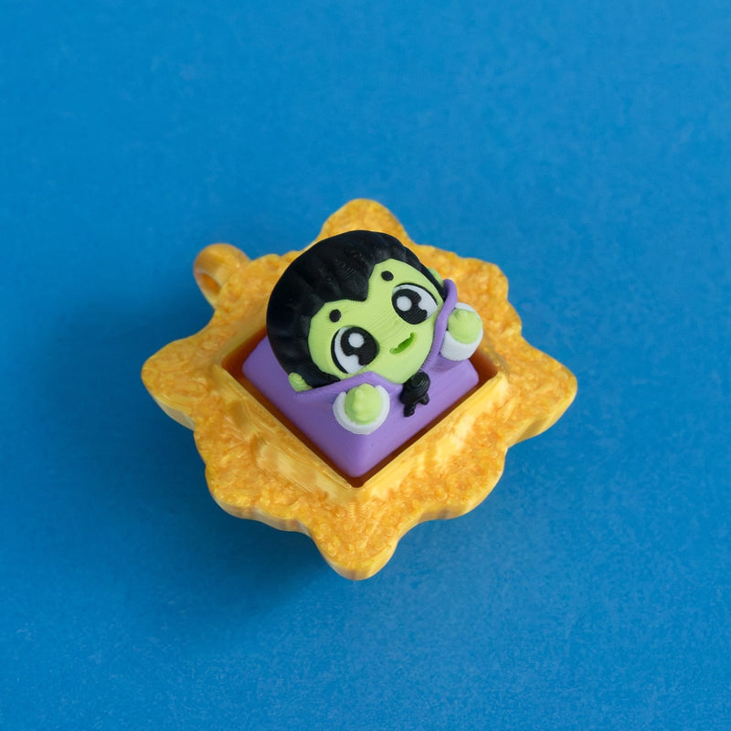 Fangy the vampire before dinner keycap in gold frame clicker.