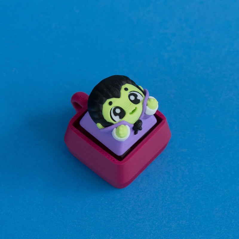 Fangy the vampire before dinner keycap on plum clicker base.