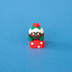 Figgy the Christmas pudding keycap from a low front angle