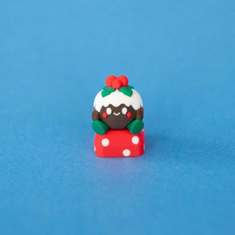Figgy the Christmas pudding keycap from a low front angle