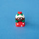 Figgy the Christmas pudding keycap with white icing and holly, front view