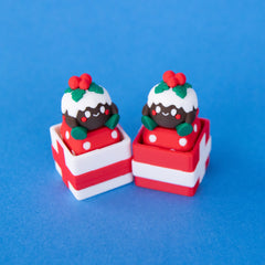 Figgy Christmas pudding keycaps sitting in red and white gift box clicker bases