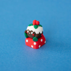 Figgy the Christmas pudding keycap, three-quarter view from the left