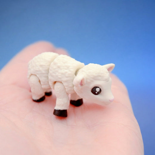 White sheep fidget toy seen from behind, showing its textured wool body and dark feet
