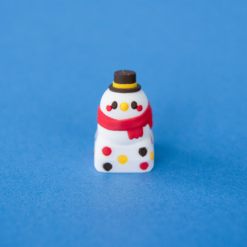 Flurry the snowman Christmas keycap from a low front angle