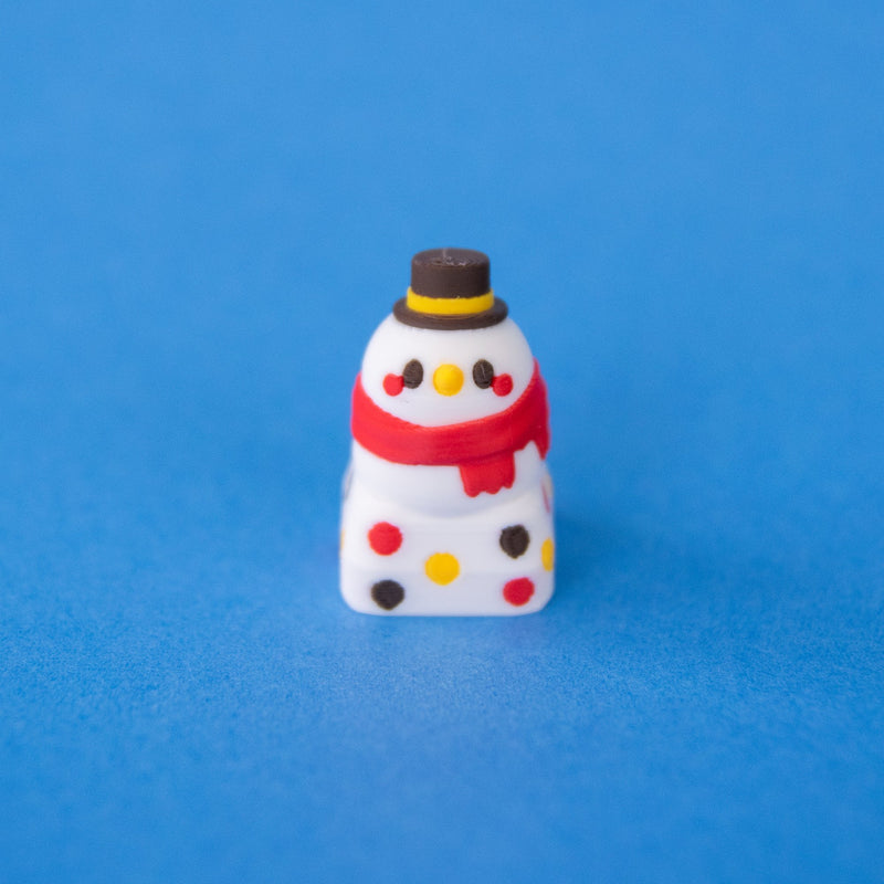 Flurry the snowman keycap with a top hat and red scarf, front view