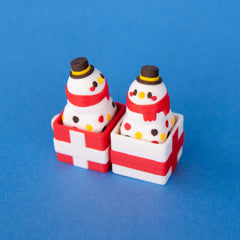 Flurry snowman keycaps sitting in red and white gift box clicker bases