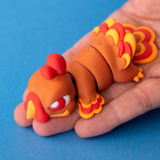 Gobb the Turkey Beastchonk resting in a palm to show his size.