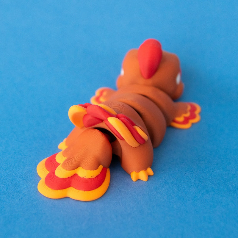 Rear view of Gobb the Turkey Beastchonk, showing his articulated body and turkey tail.
