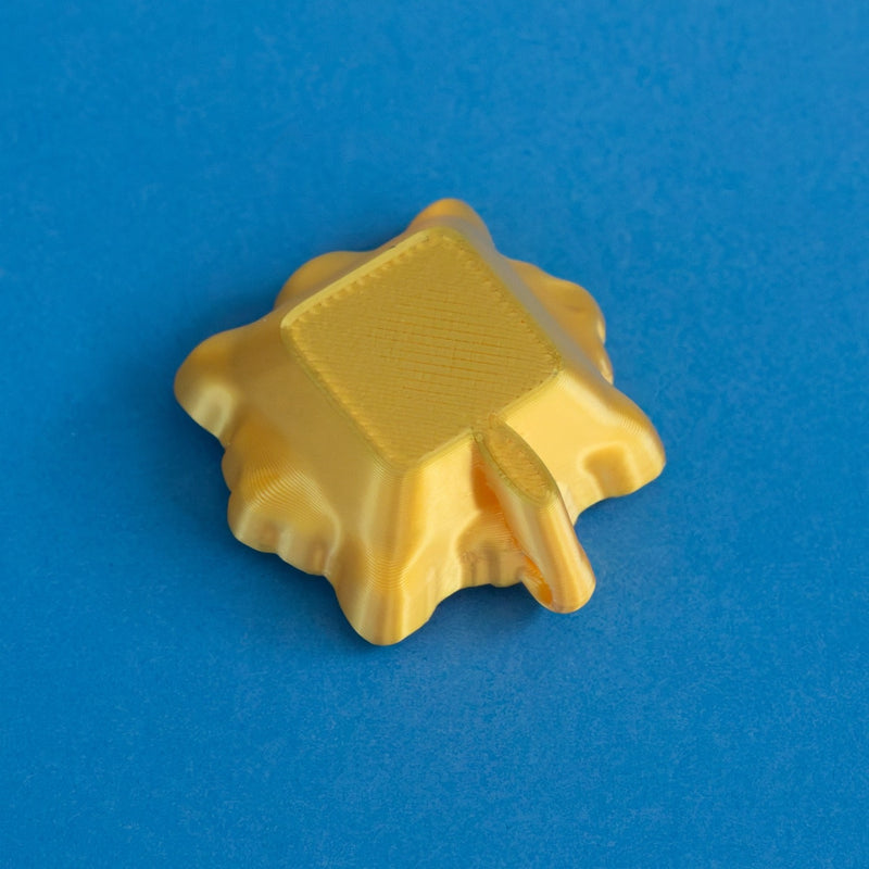 Gold frame keycap clicker rear view.
