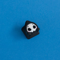 Grimsy the reaper keycap front view.