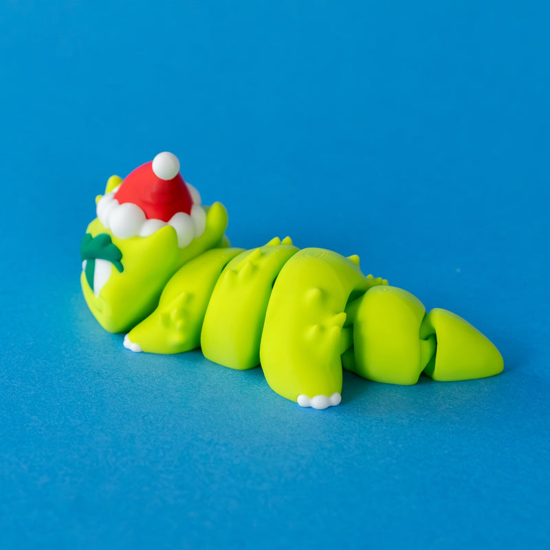 Grump stretched out showing his spiky articulated body, side view