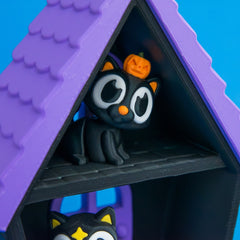 Haunted cat house bundle cinder pumpkin cat close up.
