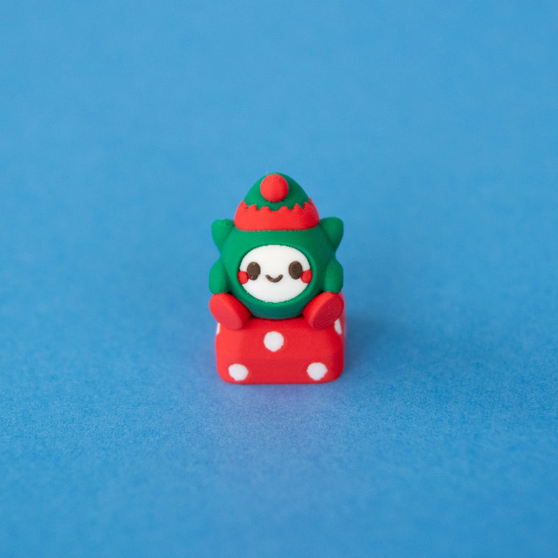 Jingle the elf keycap in a green and red elf hat, front view