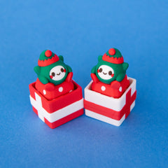 Jingle elf keycaps sitting in red and white gift box clicker bases