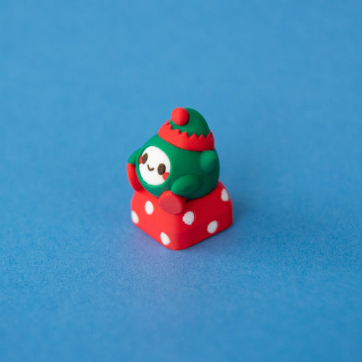 Jingle the elf Christmas keycap, three-quarter view from the left