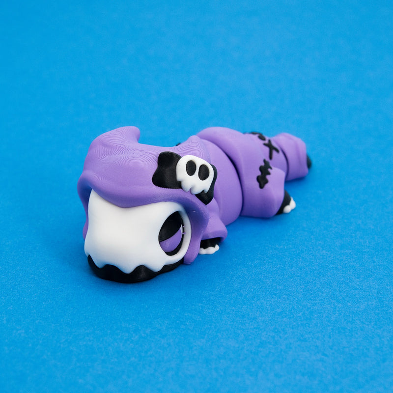 Kawaii Goth Reapo with a sleepy purple-lidded eye, front left view