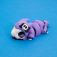 Kawaii Goth Reapo the Reaper Chonk in a lilac hood with a skull bow, front three-quarter view