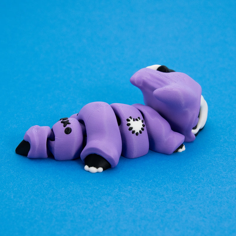 Kawaii Goth Reapo's stitched cloak and black-tipped tail, rear three-quarter view