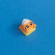Kernie the candy corn keycap front view.