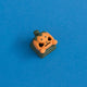 Lanty the pumpkin keycap front view.