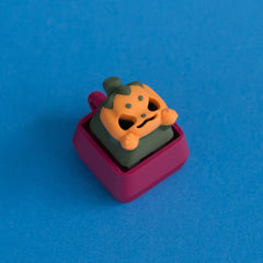 Lanty the pumpkin keycap on plum clicker base.