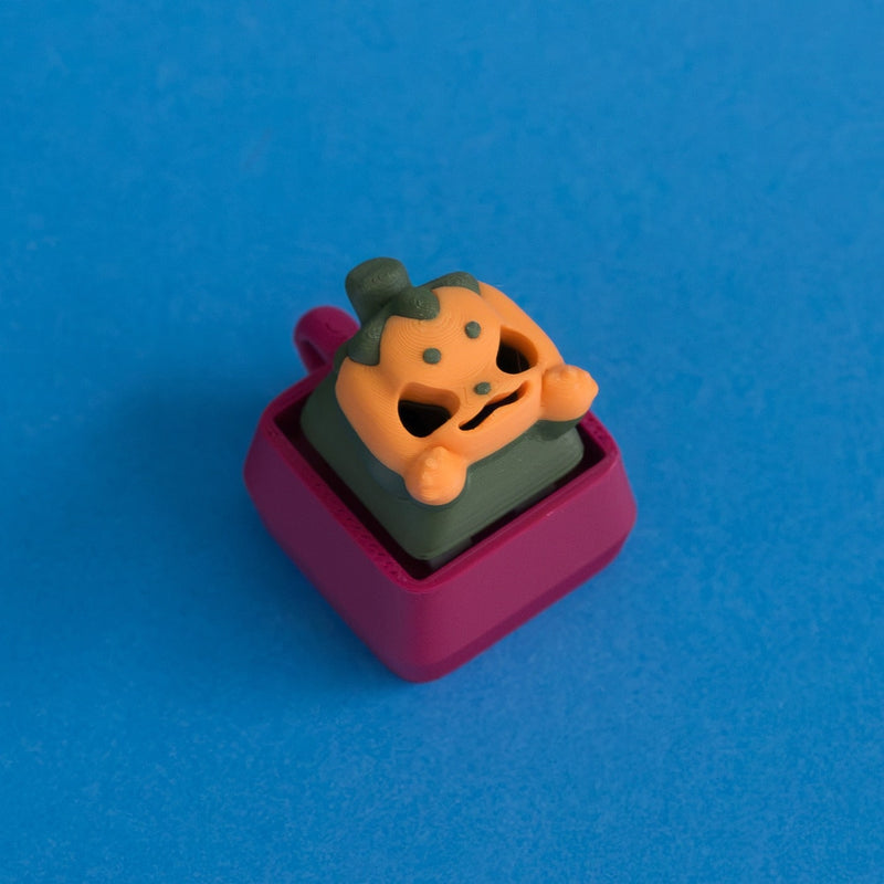 Lanty the pumpkin keycap on plum clicker base.