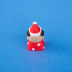 Back of Nutmeg the Santa puppy keycap, showing the Santa hat and floppy ears