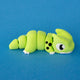 Orlo the green Dino Beast Dragon in side view, showing his segmented body, black spots and white claws.