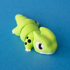 Front three-quarter view of Orlo the Dino Beast Dragon with his face, horns and articulated body visible.