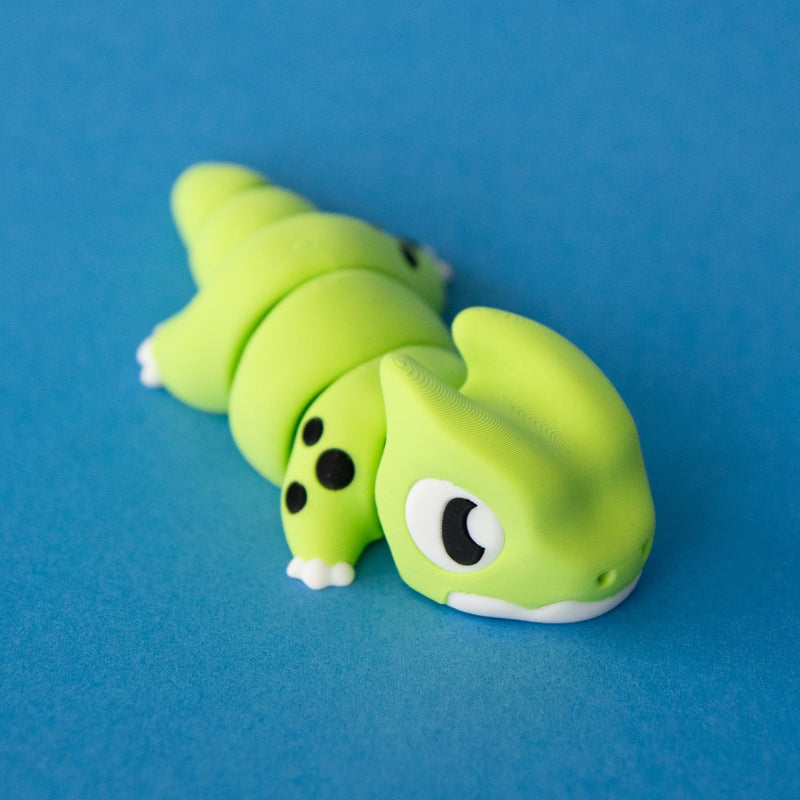Front three-quarter view of Orlo the Dino Beast Dragon with his face, horns and articulated body visible.