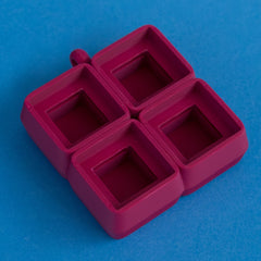 Plum four slot keycap clicker base empty front three quarter view.